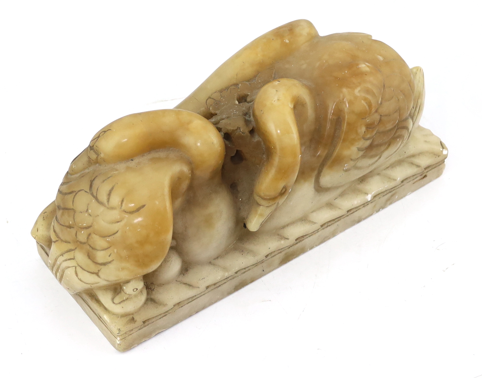 William McMillan A.R.A. (1887-1997), a carved alabaster group 'Swans', 43cm wide, 18cm high